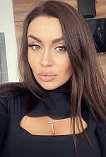 Ukrainian mail order bride Oksana from Kyiv with black hair and green eye color - image 7