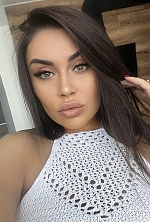 Ukrainian mail order bride Oksana from Kyiv with black hair and green eye color - image 5