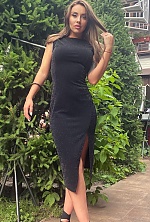 Ukrainian mail order bride Oksana from Kyiv with black hair and green eye color - image 2