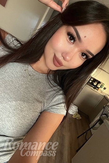 Ukrainian mail order bride Akbota from Astana with black hair and brown eye color - image 1