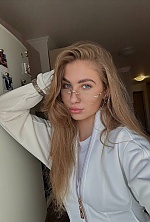 Ukrainian mail order bride Yuliia from Kyiv with blonde hair and blue eye color - image 6